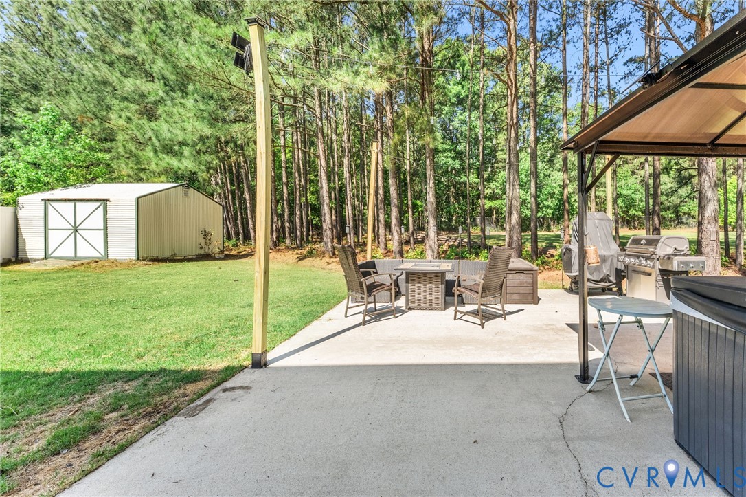 3120 Denise Road Petersburg, VA 23805 - Photo 9 of 51 Expansive concrete patio area with a permanent gaz