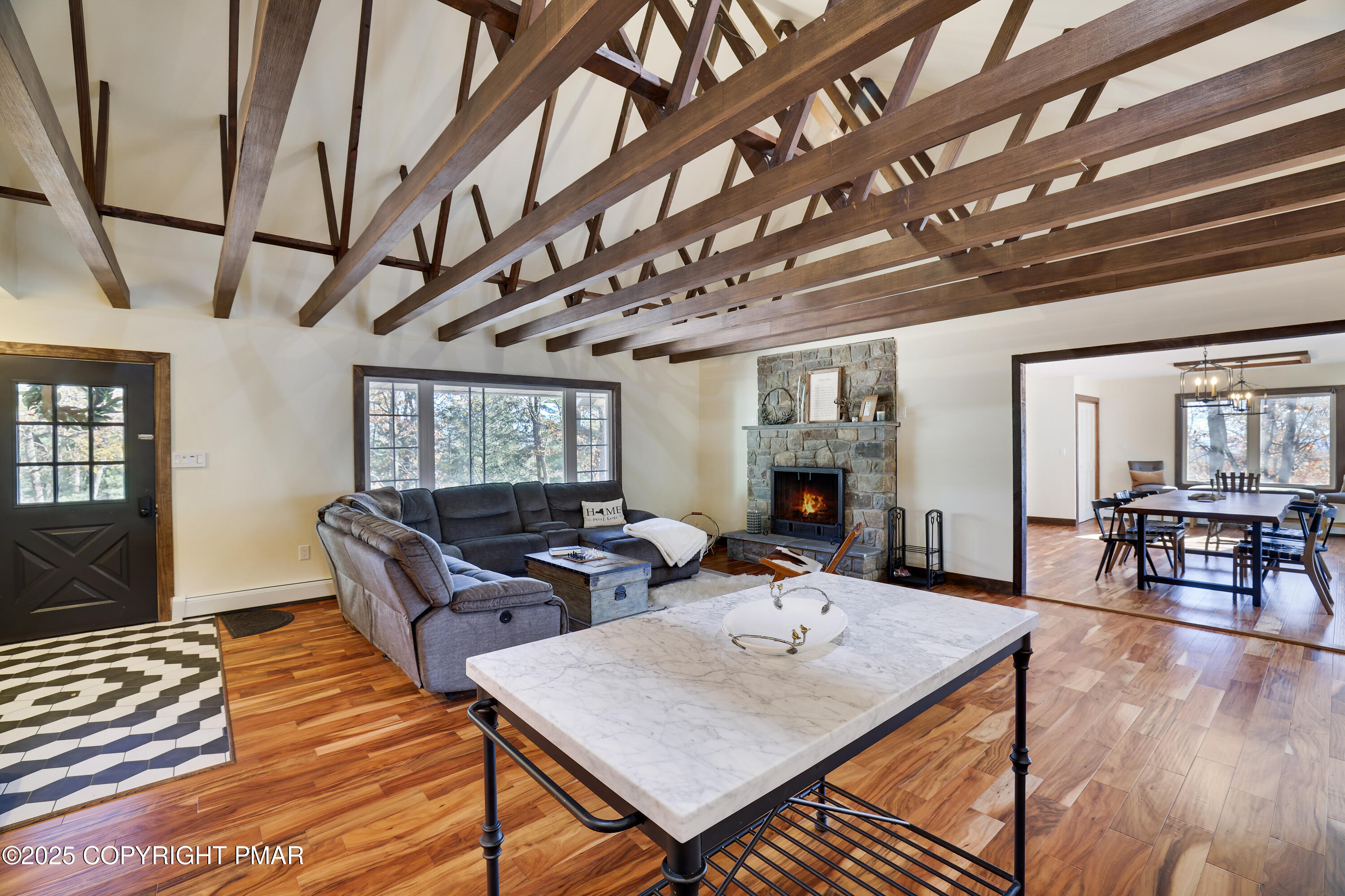 104 Haverhill Road Cresco, PA 18326 - Photo 14 of 86 a living room with furniture a table and wooden floor