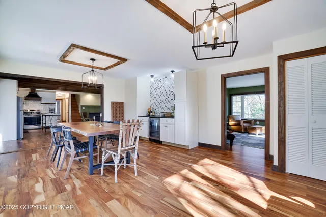 an aerial view of a house with a swimming pool outdoor seating and yard