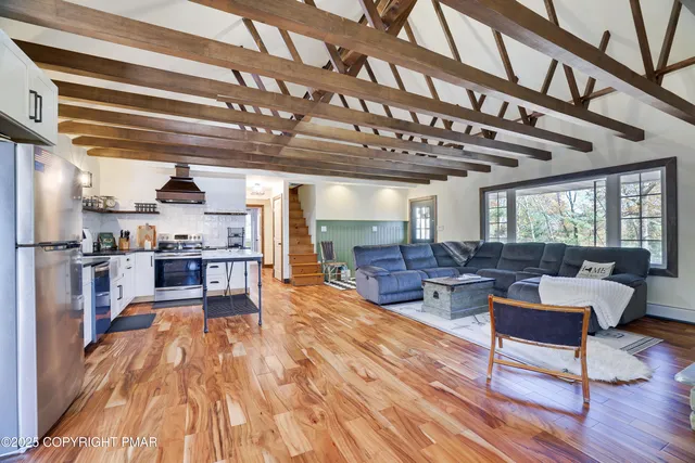a living room with couch and a fireplace