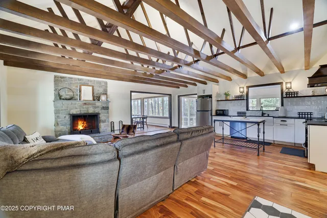 a living room with furniture and a fireplace