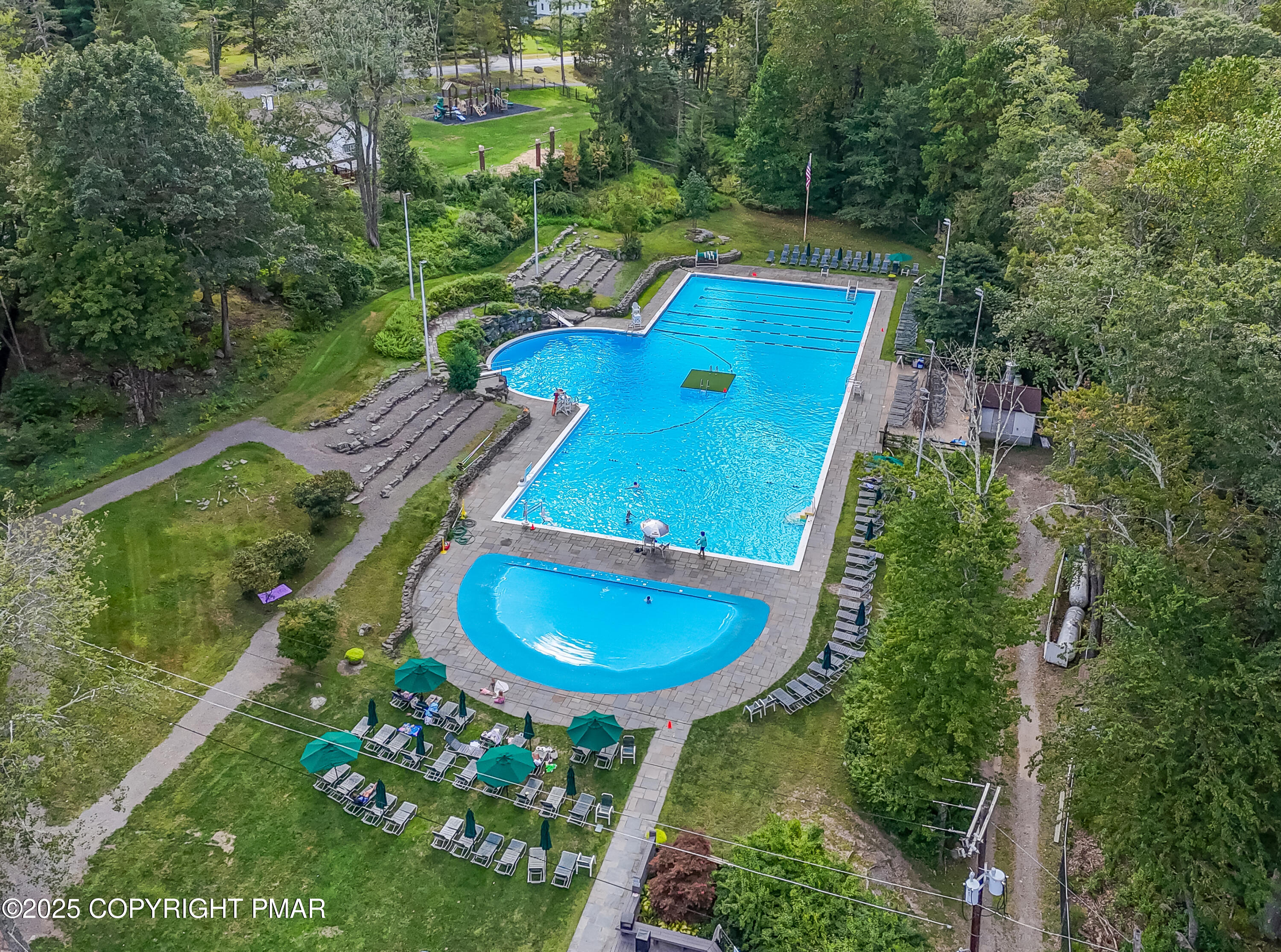 104 Haverhill Road Cresco, PA 18326 - Photo 59 of 86 an aerial view of a backyard with table and chairs with a swimming pool