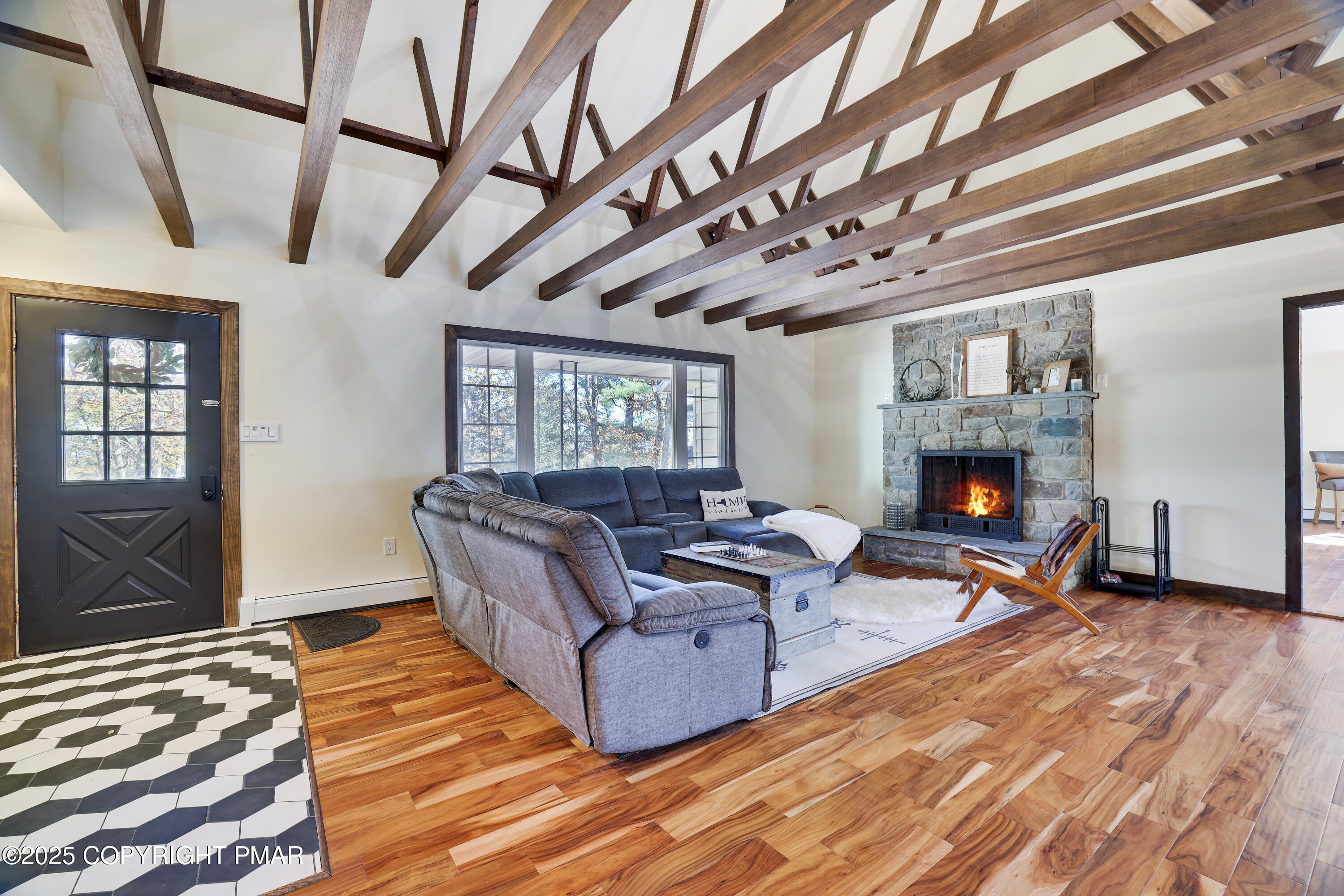 104 Haverhill Road Cresco, PA 18326 - Photo 7 of 86 a living room with furniture and a fireplace