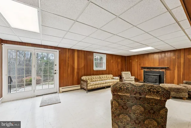 a spacious bedroom with a large bed and a couch