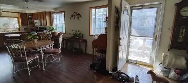 a view of a dining room with furniture window and wooden floor