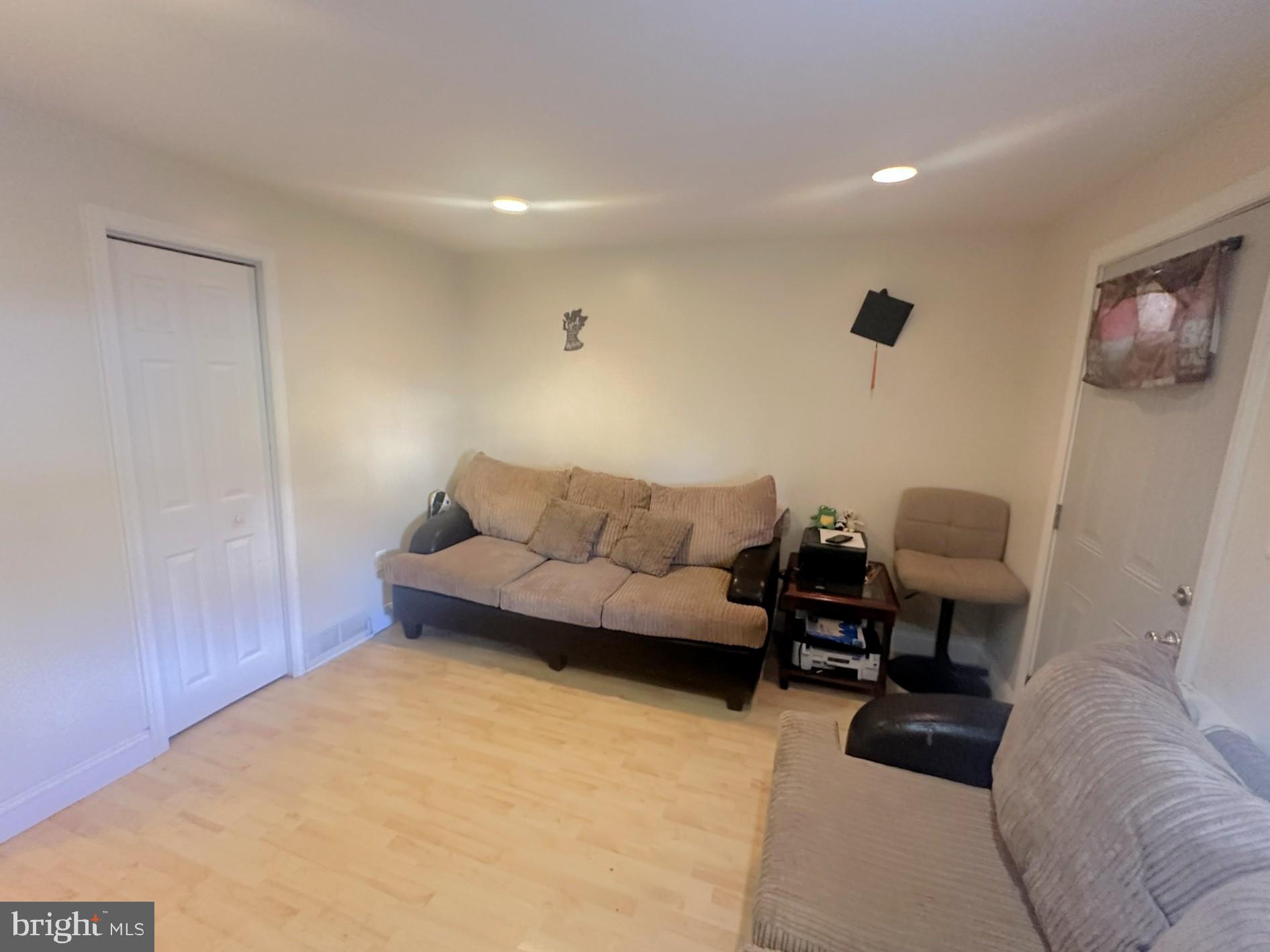 209 Fulton Street Hanover, PA 17331 - Photo 11 of 32 a living room with furniture and a couch