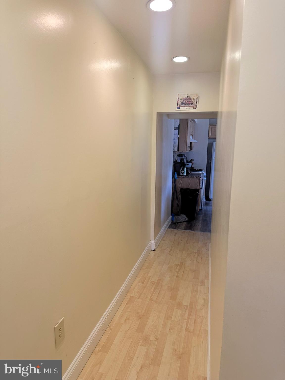 209 Fulton Street Hanover, PA 17331 - Photo 12 of 32 a view of a hallway to a room with a chair