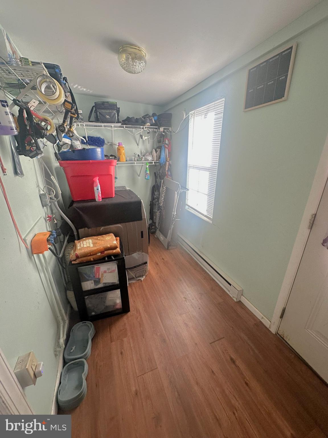 209 Fulton Street Hanover, PA 17331 - Photo 17 of 32 a living room with furniture a flat screen tv and a window