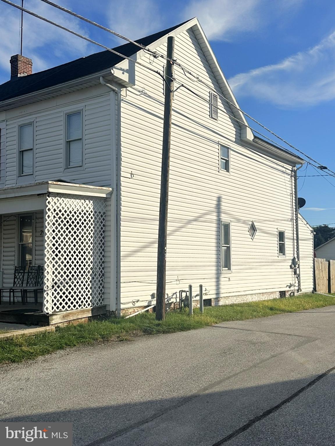 209 Fulton Street Hanover, PA 17331 - Photo 2 of 32 a front view of a house with a yard and garage