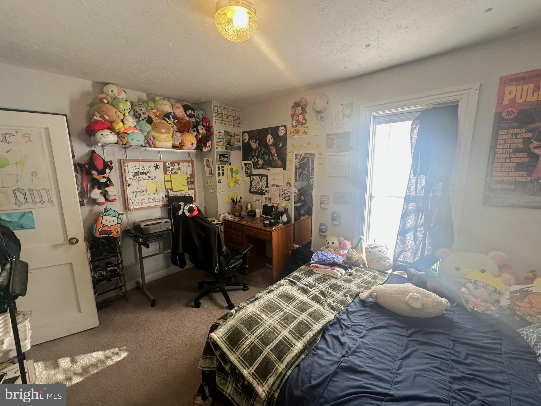 209 Fulton Street Hanover, PA 17331 - Photo 23 of 32 a bedroom that has a bed and a chair in it