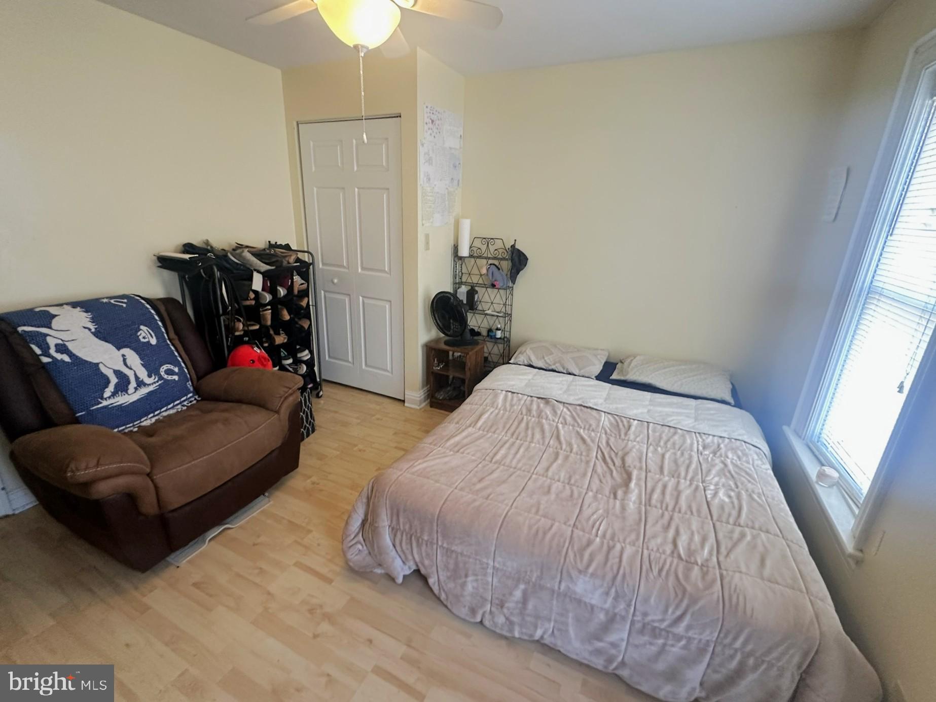 209 Fulton Street Hanover, PA 17331 - Photo 25 of 32 a bedroom with a bed couch and chandelier