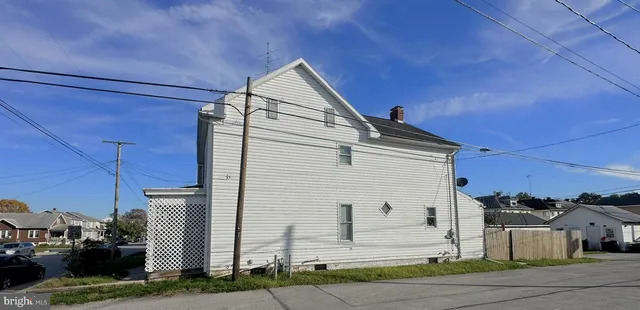 a view of a house with a street