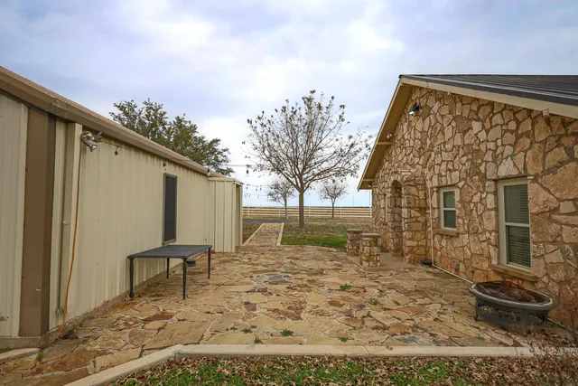 a kitchen with a table chairs stove and refrigerator