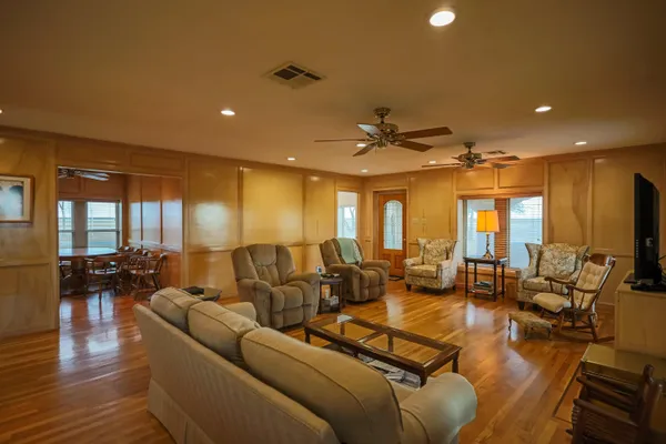 a view of a dining room with furniture and window