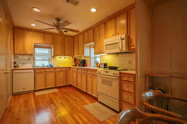 a bathroom with a shower and a glass door