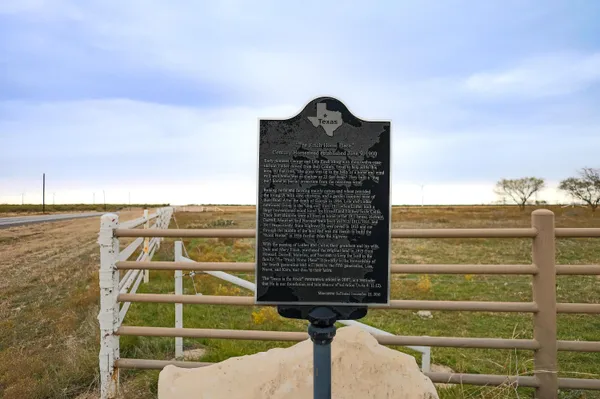 a view of street with houses on both side of it