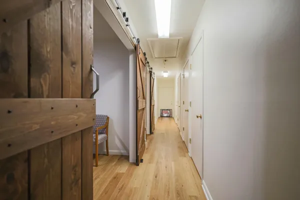 a bathroom with a sink mirror vanity and toilet