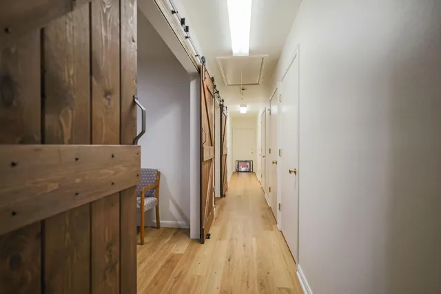 a bathroom with a sink mirror vanity and toilet