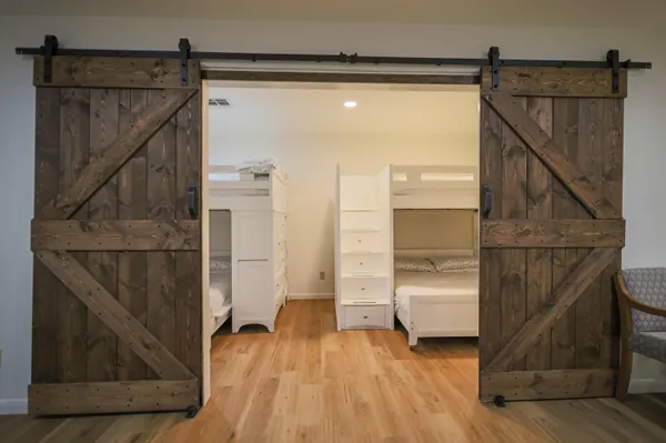 a bathroom with a toilet sink vanity and mirror