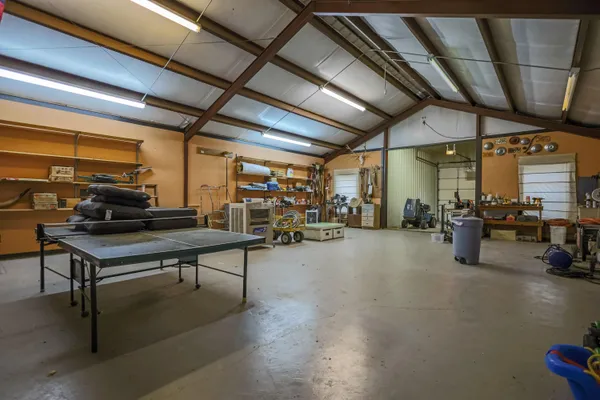 a view of a lake with beach and wooden floor