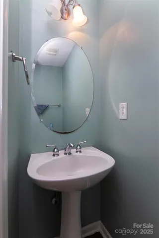 a bathroom with a sink and mirror