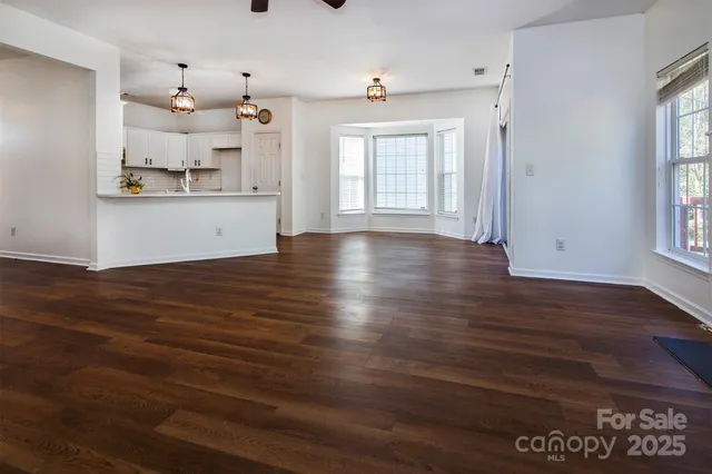 a view of kitchen with window and wooden floor