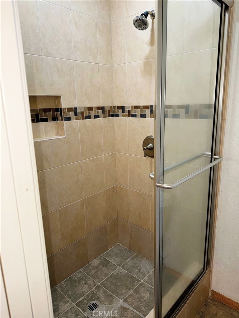 18419 Collins Street, Unit E Tarzana, CA 91356 - Photo 21 of 40 a bathroom with a shower