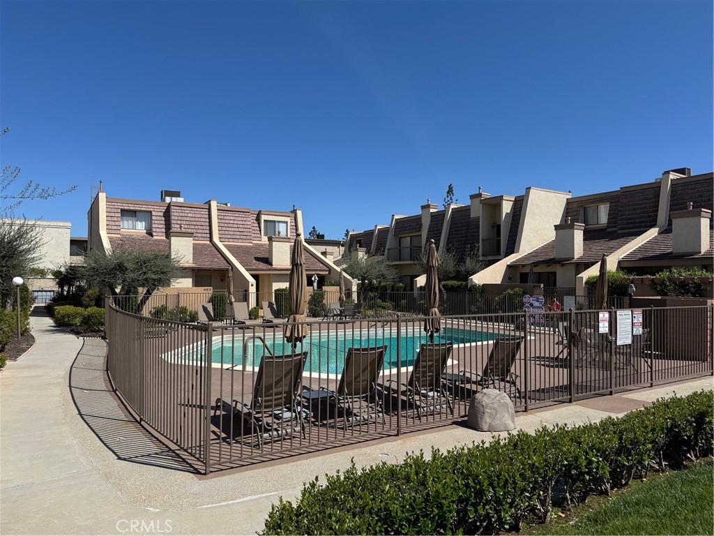 18419 Collins Street, Unit E Tarzana, CA 91356 - Photo 29 of 40 a view of a chairs and table in the patio