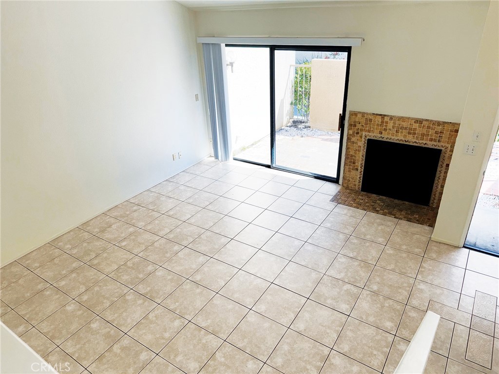 18419 Collins Street, Unit E Tarzana, CA 91356 - Photo 3 of 40 an empty room with windows