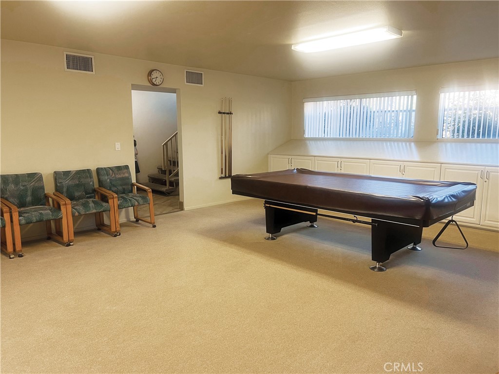 18419 Collins Street, Unit E Tarzana, CA 91356 - Photo 37 of 40 a room with furniture pool table and chairs