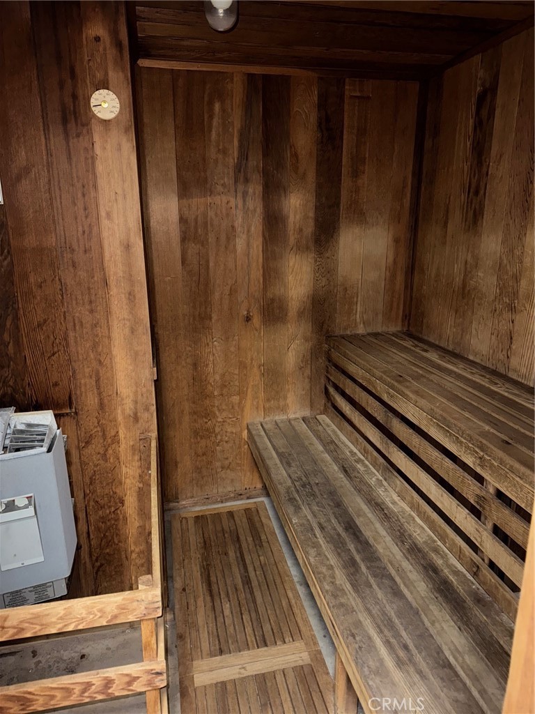 18419 Collins Street, Unit E Tarzana, CA 91356 - Photo 39 of 40 a view of a balcony with wooden floor and bench