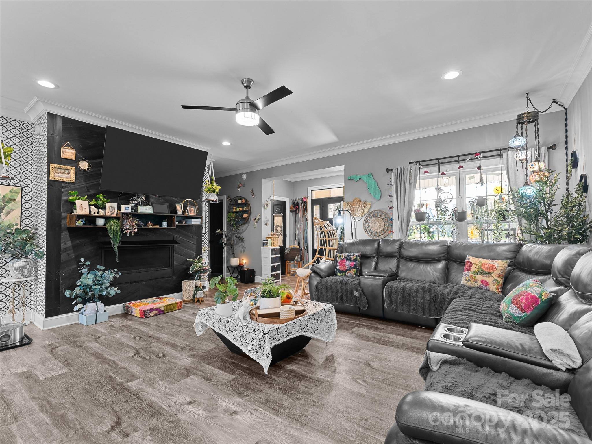 1154 North Ridge Road Hendersonville, NC 28792 - Photo 13 of 29 a living room with furniture and a flat screen tv