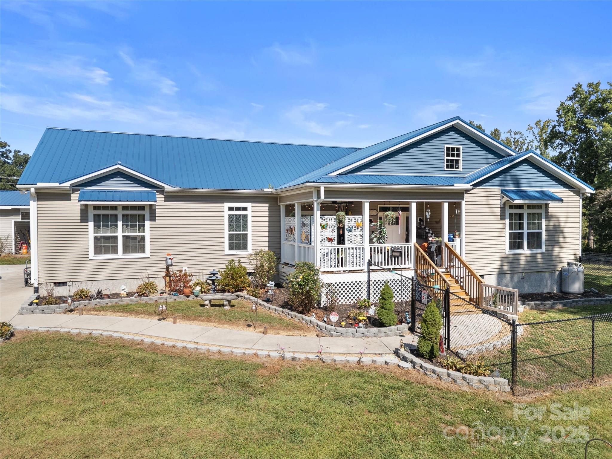 1154 North Ridge Road Hendersonville, NC 28792 - Photo 2 of 29 a front view of a house with a yard