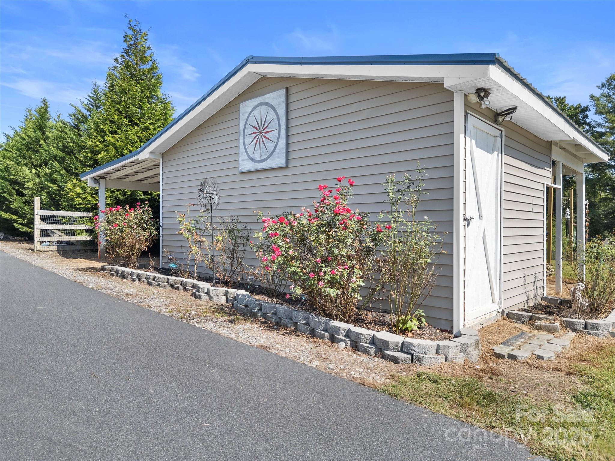1154 North Ridge Road Hendersonville, NC 28792 - Photo 29 of 29 a view of a house with a street