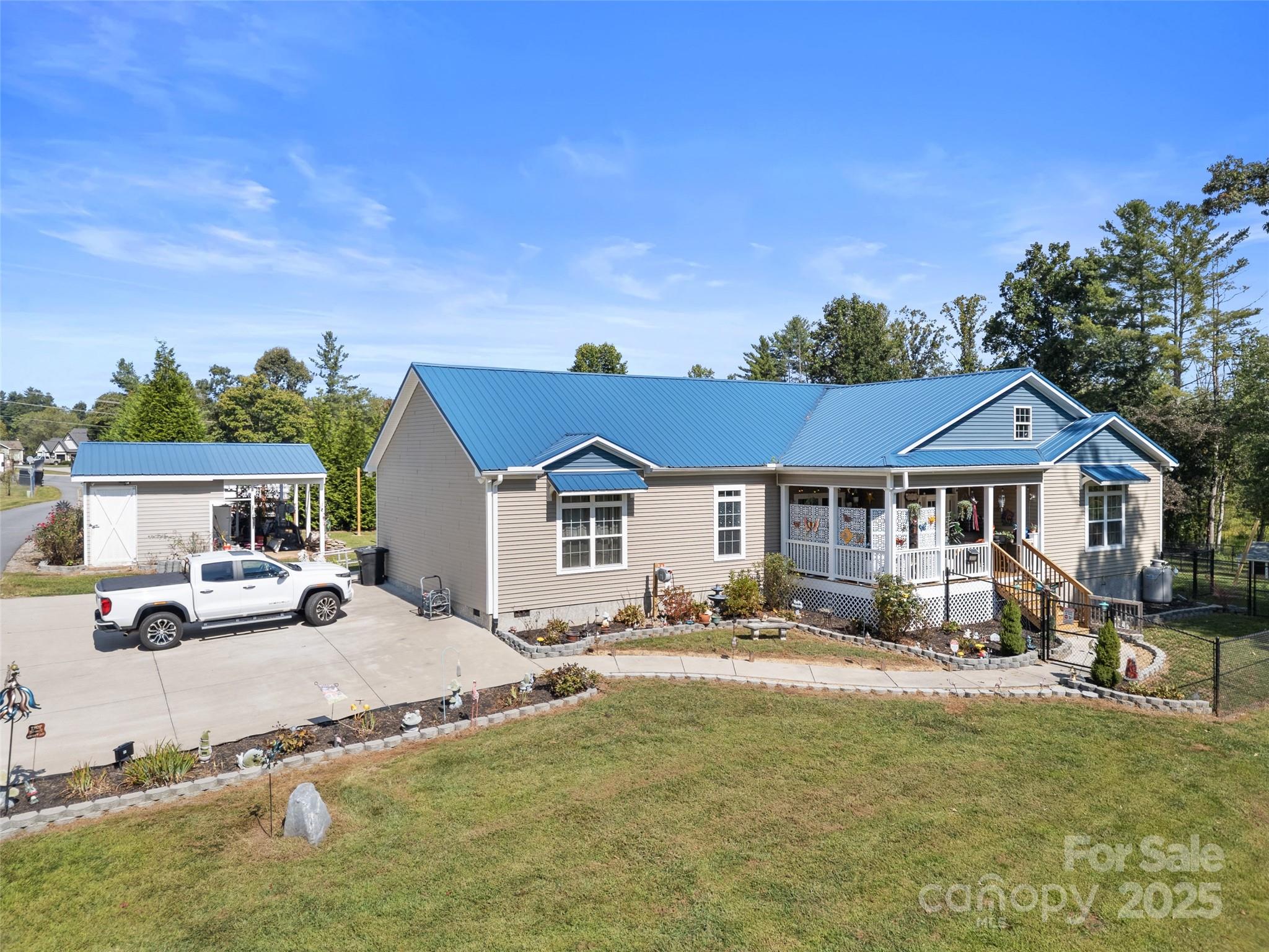 1154 North Ridge Road Hendersonville, NC 28792 - Photo 4 of 29 a front view of a house with a yard