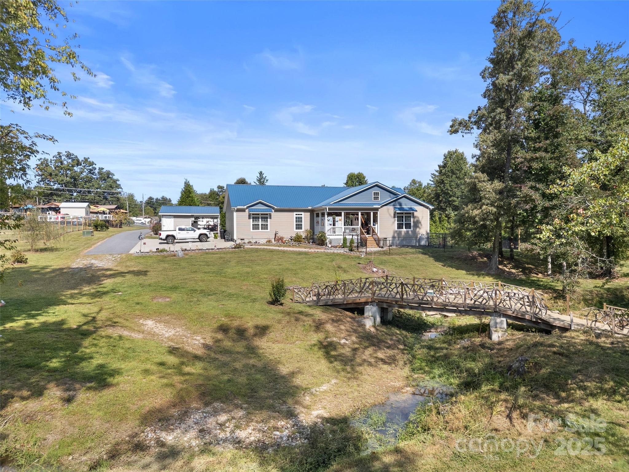 1154 North Ridge Road Hendersonville, NC 28792 - Photo 5 of 29 a view of a house with a big yard