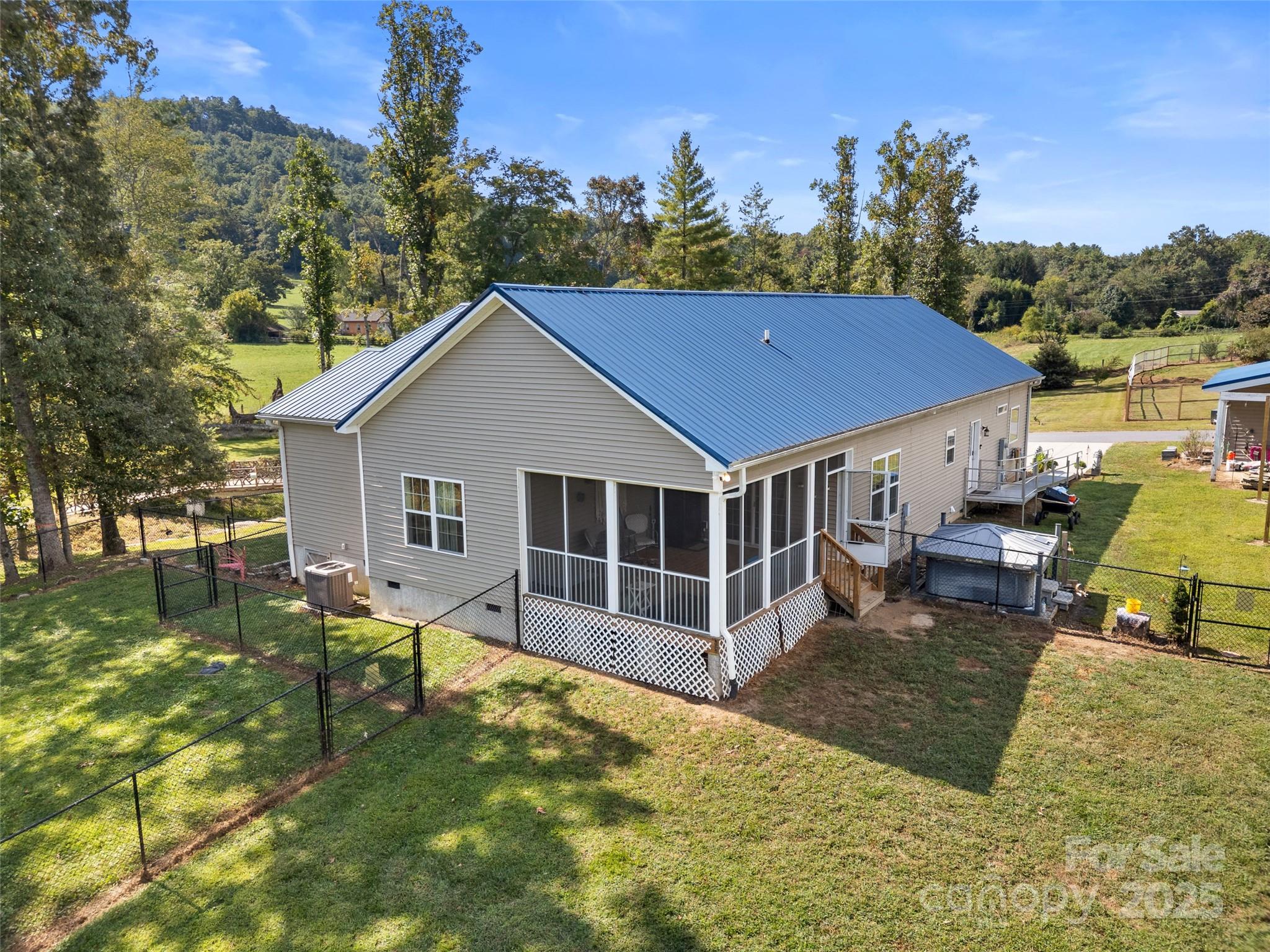 1154 North Ridge Road Hendersonville, NC 28792 - Photo 6 of 29 a view of a house with backyard and sitting area