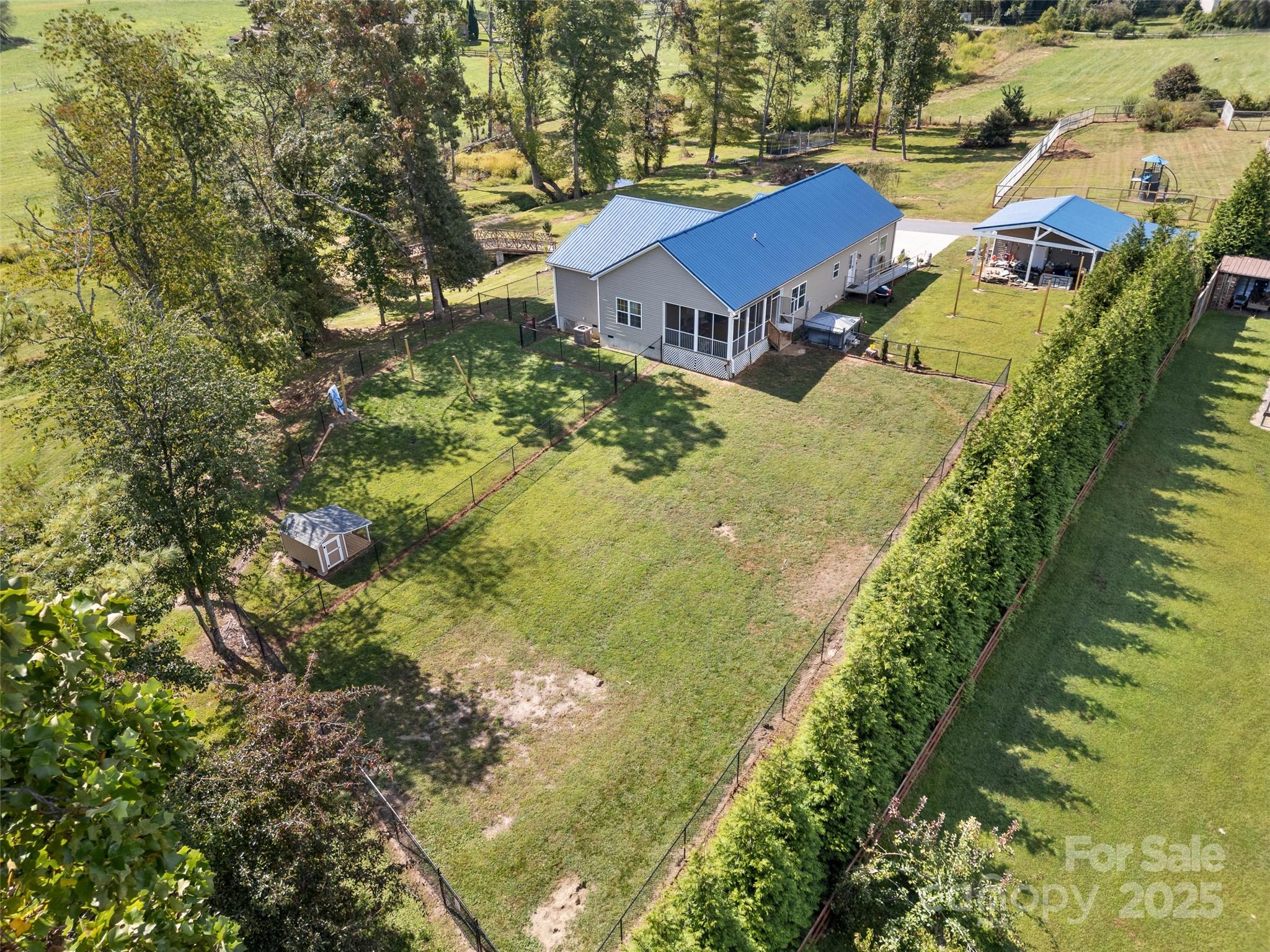 1154 North Ridge Road Hendersonville, NC 28792 - Photo 9 of 29 a aerial view of residential houses with outdoor space and trees