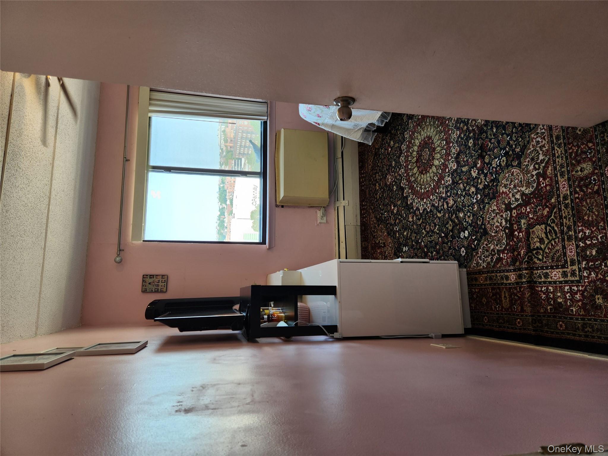 92-29 Queens Boulevard, Unit 11D Queens, NY 11374 - Photo 12 of 22 a room with a window