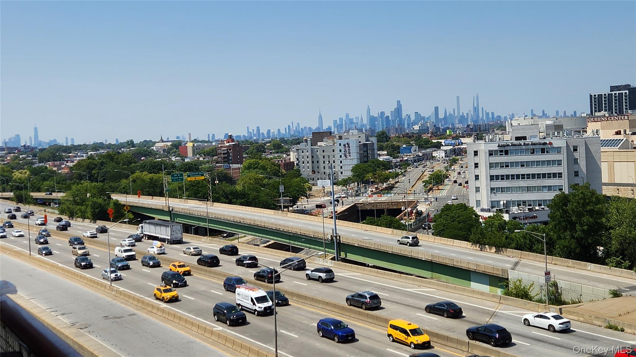 92-29 Queens Boulevard, Unit 11D Queens, NY 11374 - Photo 3 of 22 a view of roof deck with tall buildings and ocean view