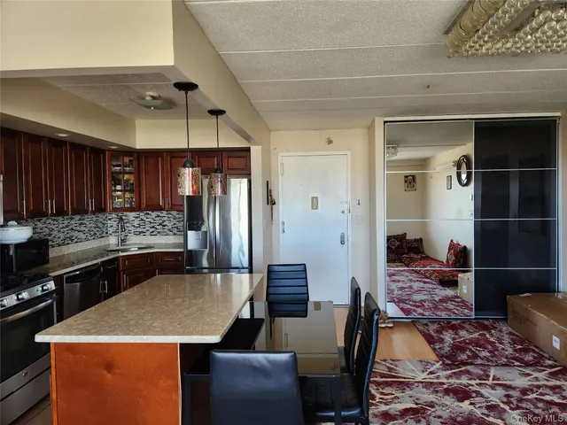 a kitchen with a table and chairs in it