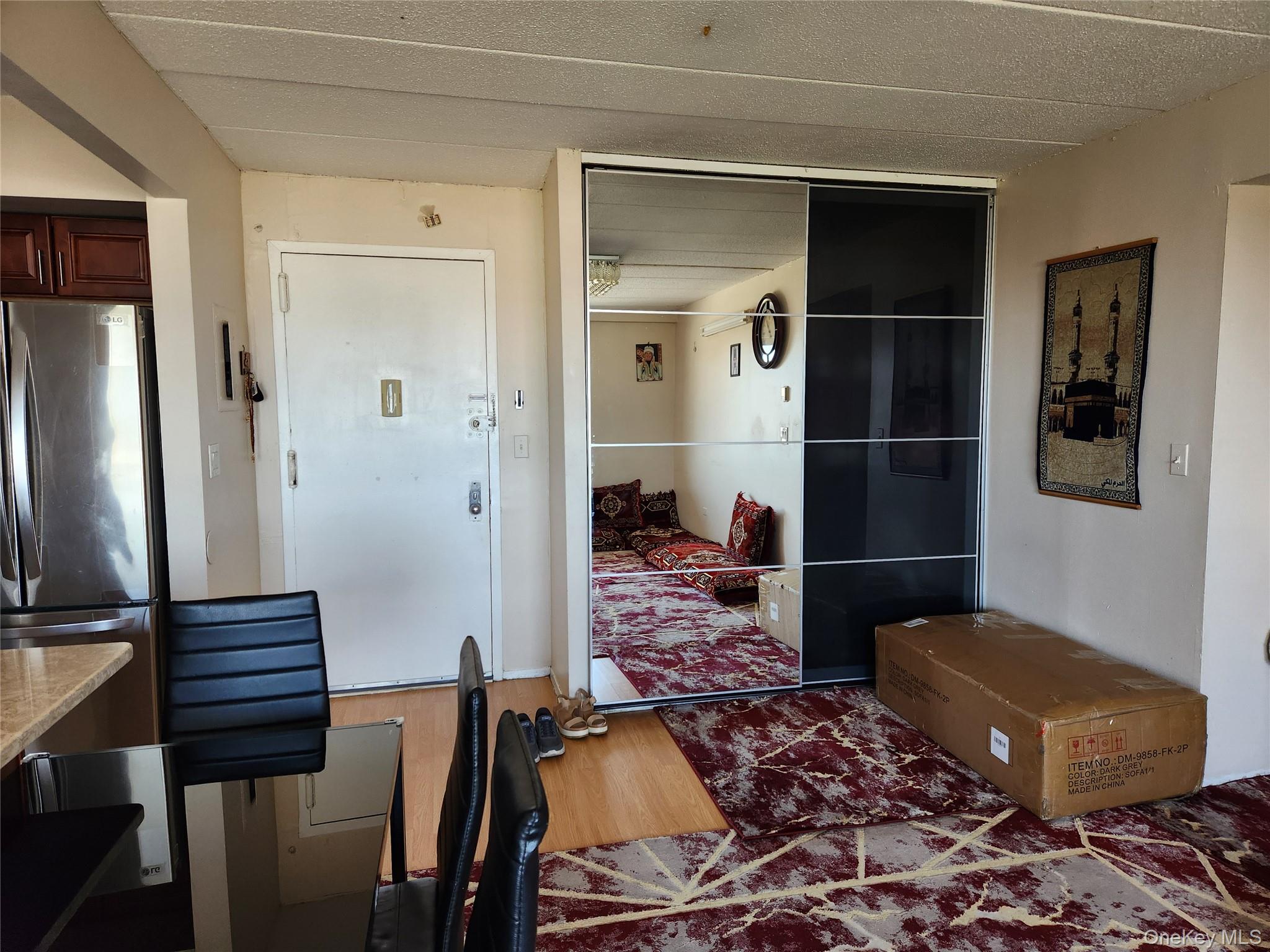 92-29 Queens Boulevard, Unit 11D Queens, NY 11374 - Photo 7 of 22 a living room with a rug and wooden floor