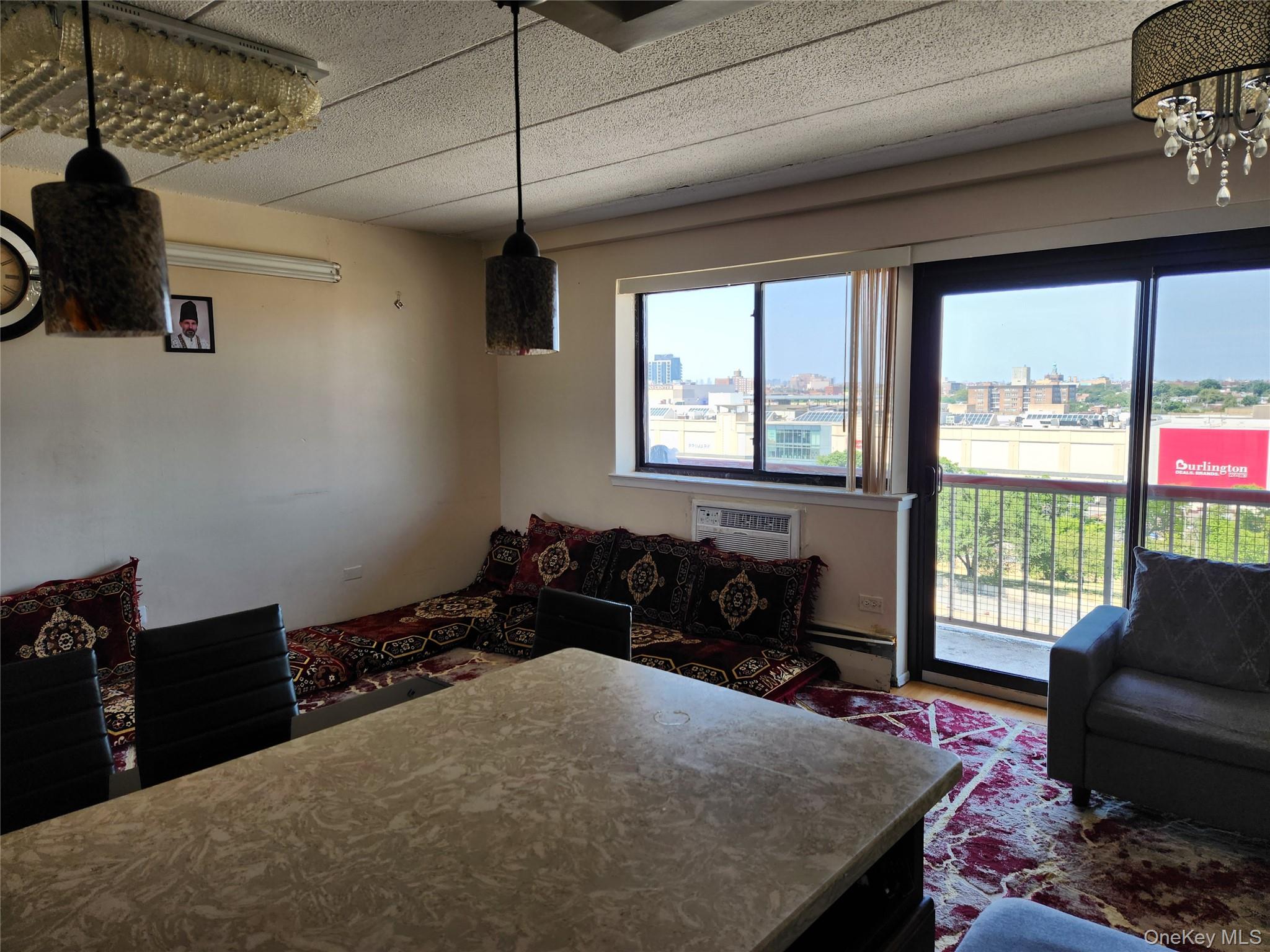 92-29 Queens Boulevard, Unit 11D Queens, NY 11374 - Photo 8 of 22 a bedroom with a bed and a couch