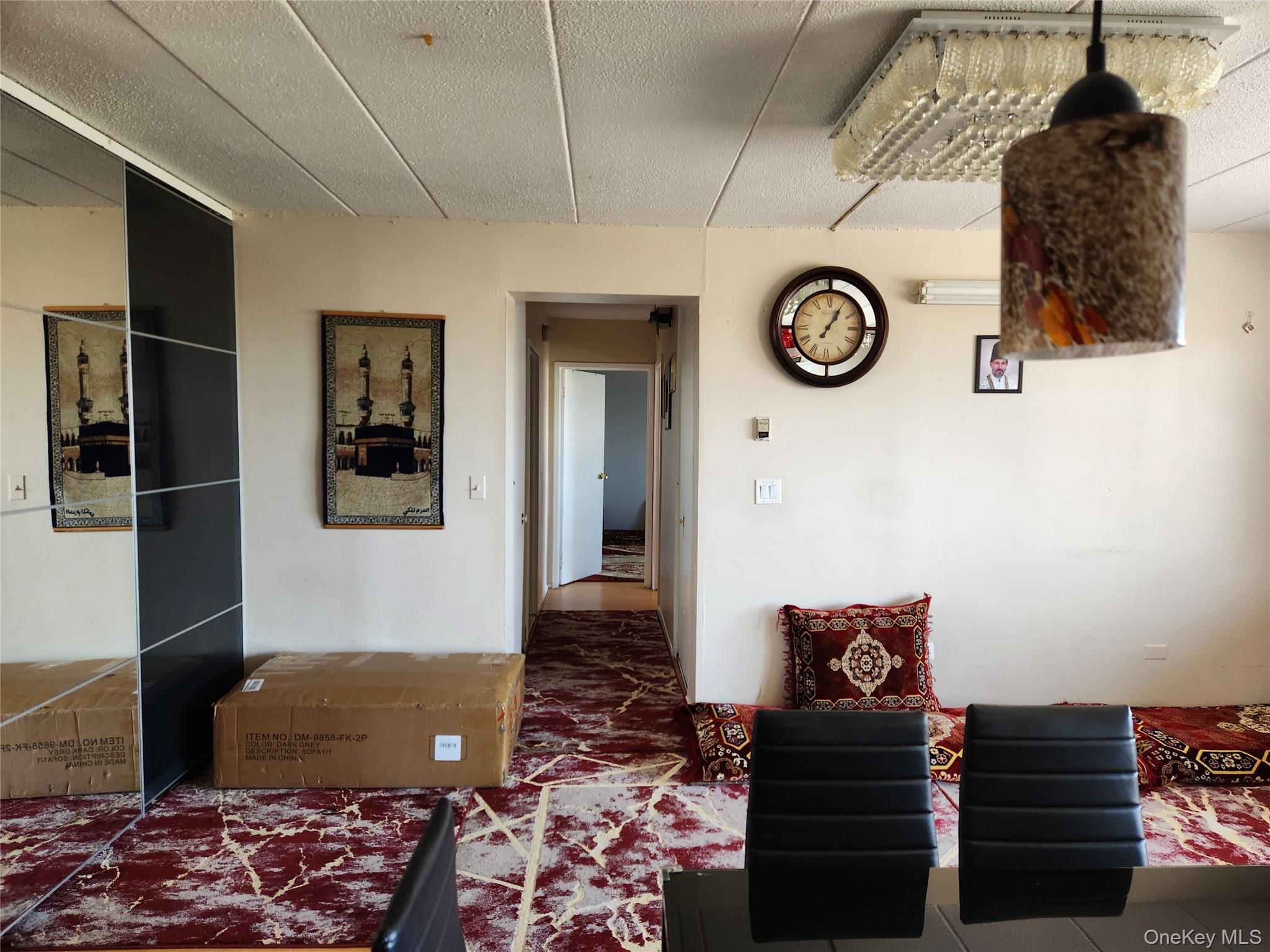 92-29 Queens Boulevard, Unit 11D Queens, NY 11374 - Photo 10 of 22 a living room with a couch and cabinets