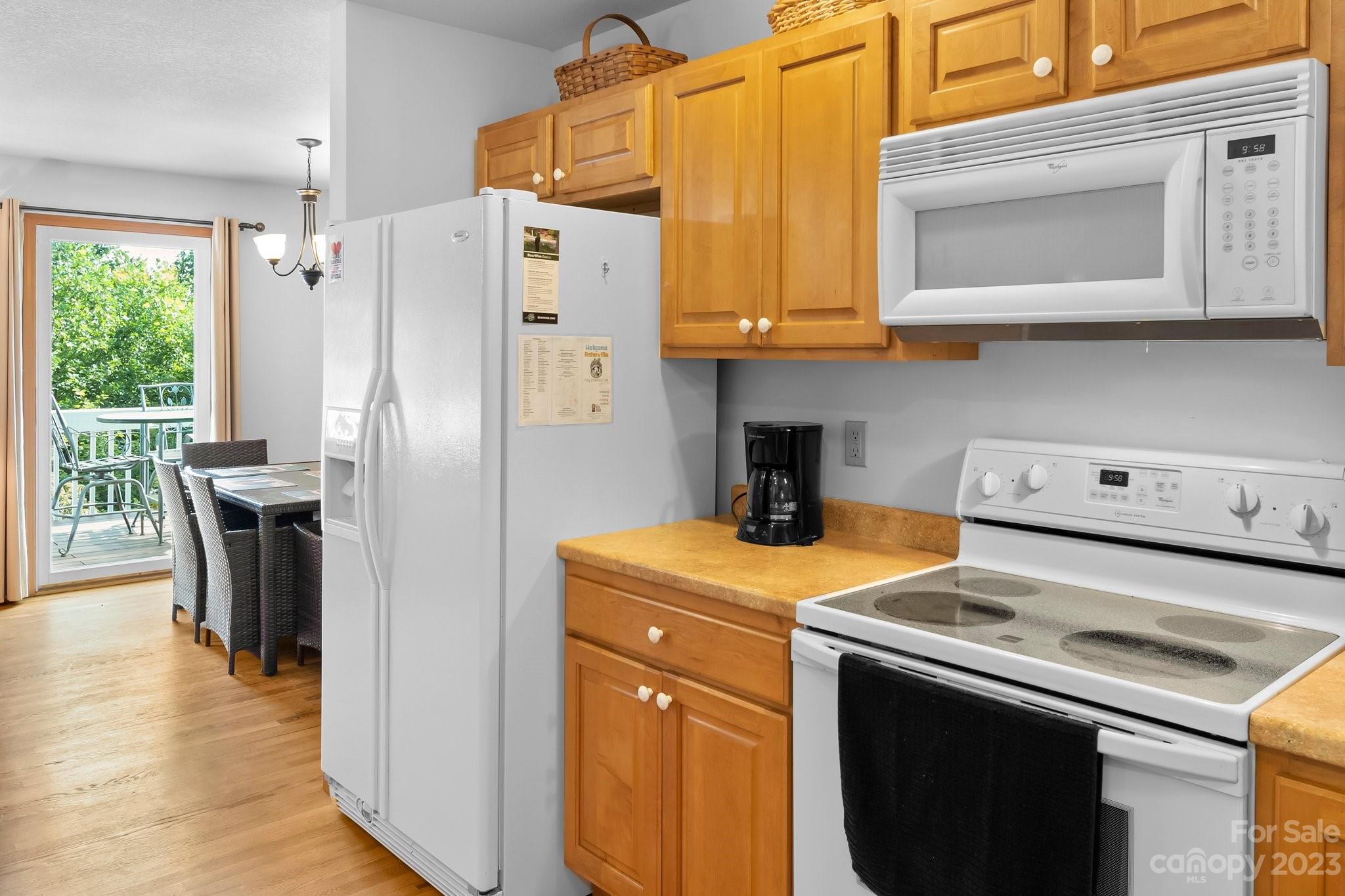 40 Autumn View Drive Hendersonville, NC 28792 - Photo 12 of 48 a kitchen with a stove a refrigerator and a table