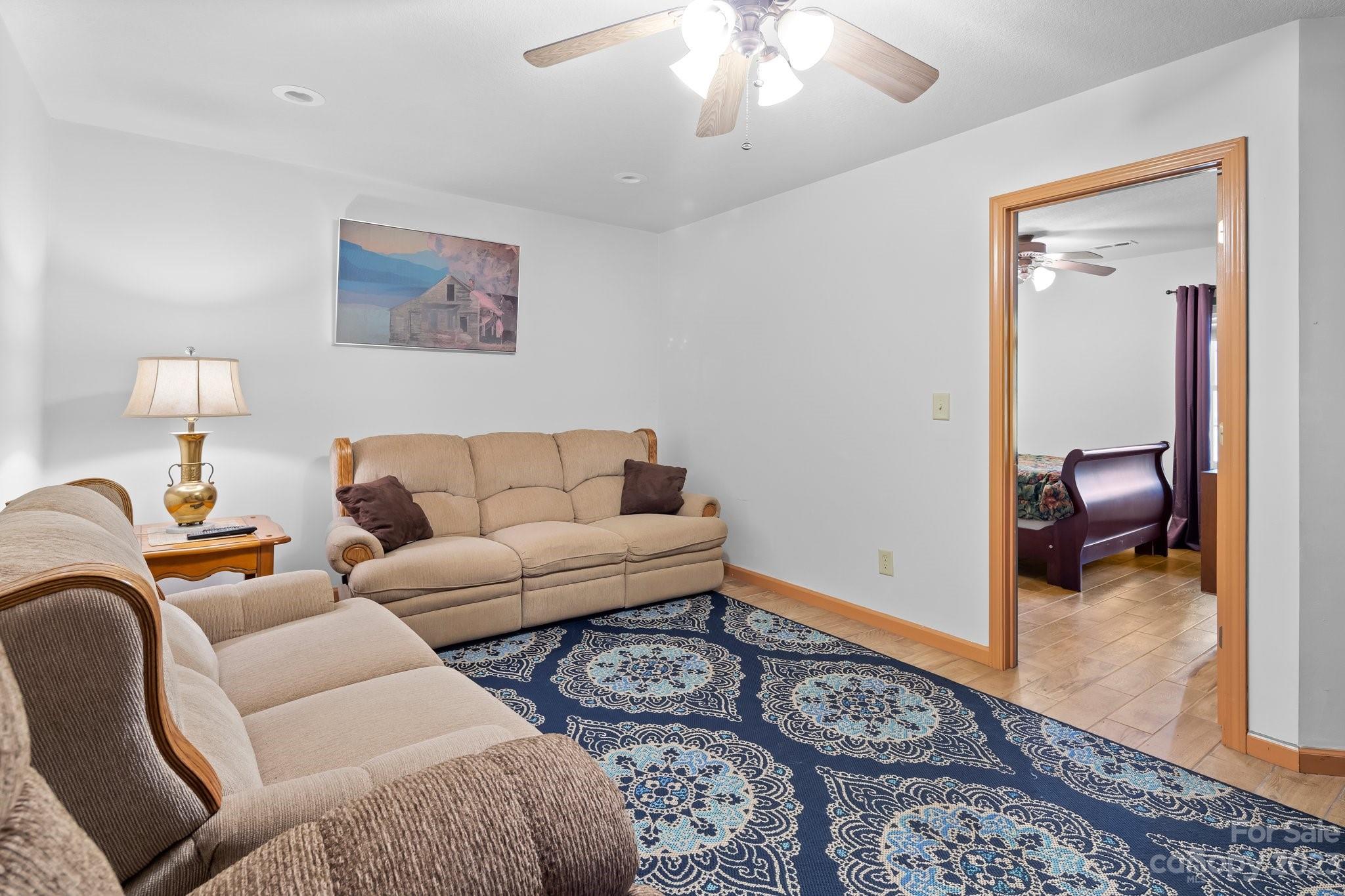 40 Autumn View Drive Hendersonville, NC 28792 - Photo 25 of 48 a living room with furniture a couch and wooden floor