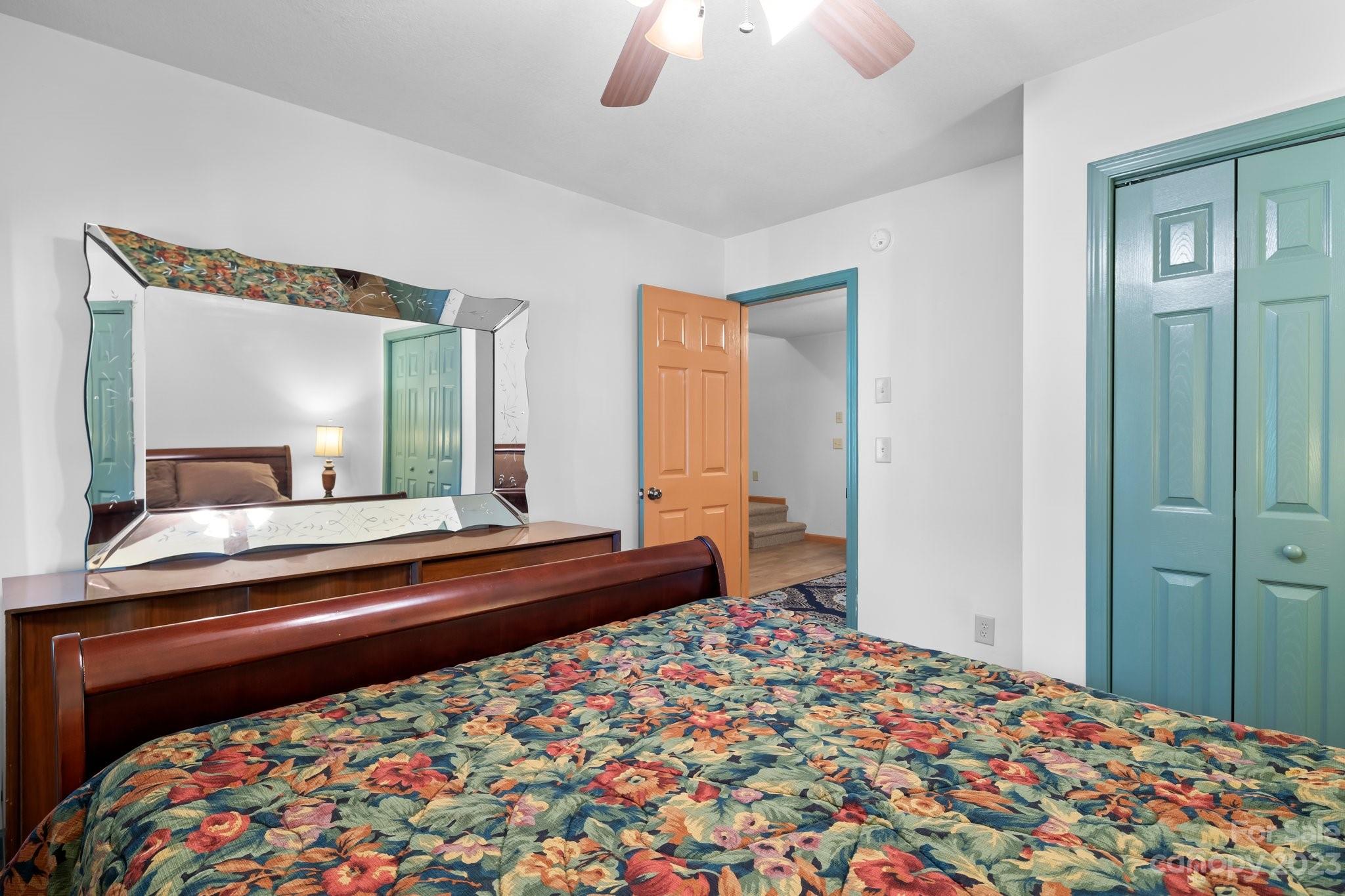 40 Autumn View Drive Hendersonville, NC 28792 - Photo 27 of 48 a bedroom with a bed and a mirror