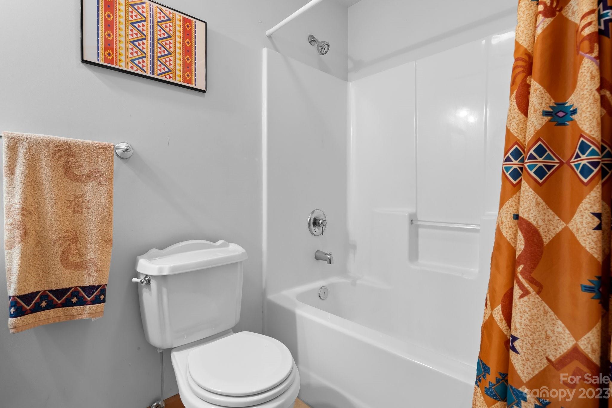40 Autumn View Drive Hendersonville, NC 28792 - Photo 29 of 48 a white toilet sitting next to a bath tub