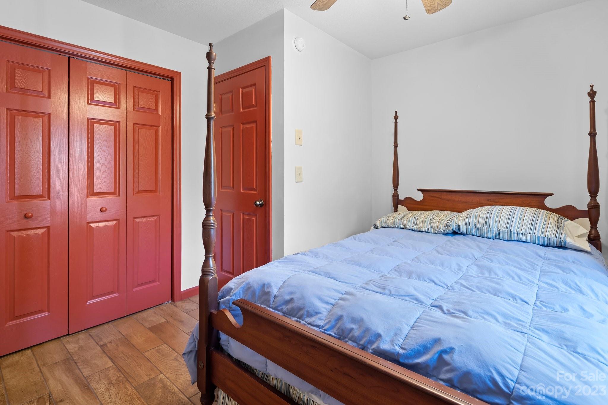 40 Autumn View Drive Hendersonville, NC 28792 - Photo 32 of 48 a bedroom with a bed and wooden floor