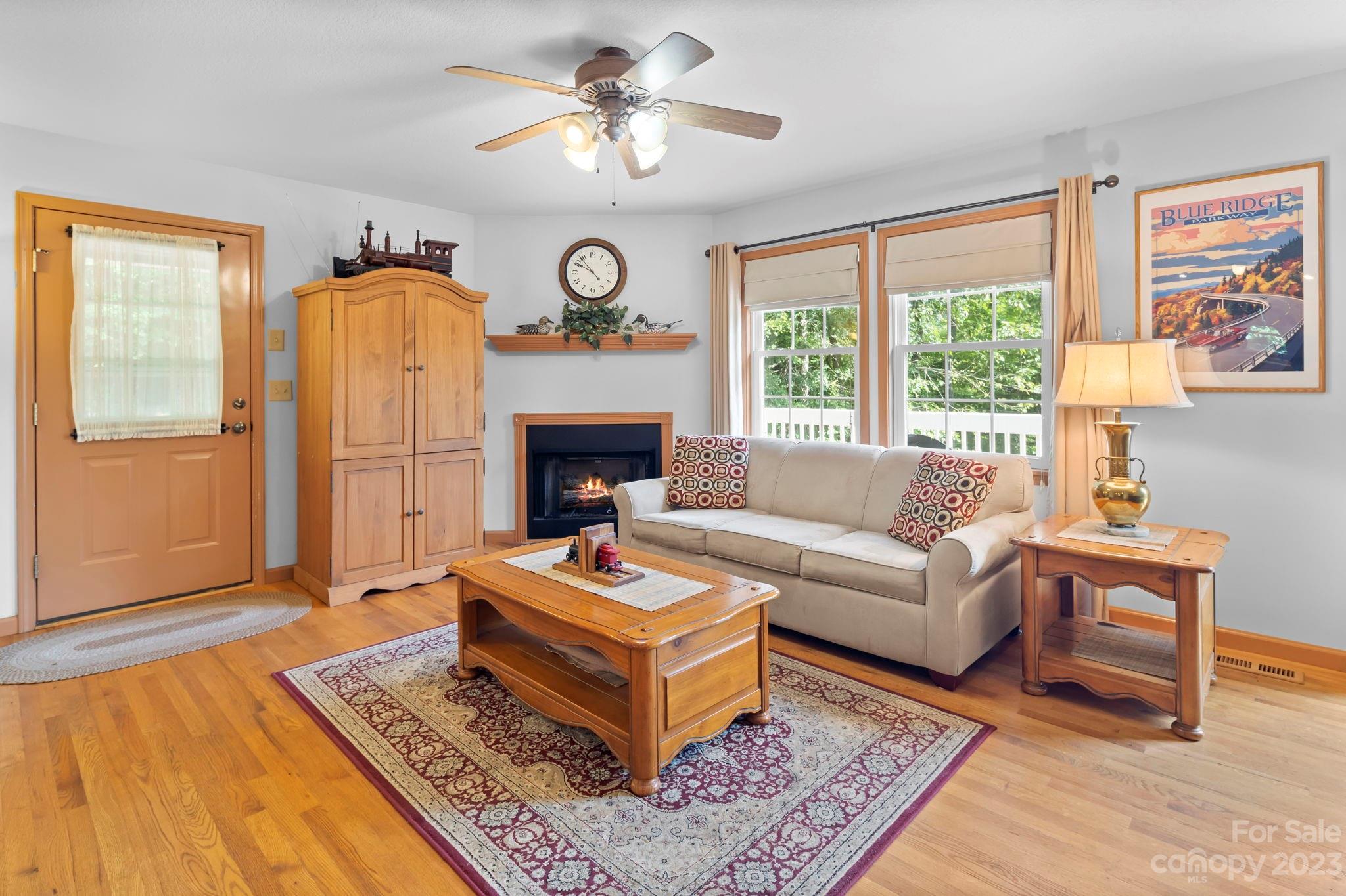 40 Autumn View Drive Hendersonville, NC 28792 - Photo 7 of 48 a living room with furniture a rug and a fireplace